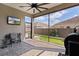 Outdoor patio with brick flooring, a black ceiling fan, and screened in windows at 3202 Condrey Ct, The Villages, FL 32163