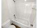 Clean bathroom features a tub with white tile surround and modern fixtures at 3230 Buck Hill Pl, Orlando, FL 32817