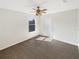 Cozy bedroom with carpet, natural light from a window, and a ceiling fan at 3230 Buck Hill Pl, Orlando, FL 32817