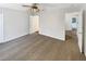 Bedroom featuring neutral carpet, a ceiling fan, and an en-suite at 3230 Buck Hill Pl, Orlando, FL 32817