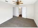 Bedroom with neutral carpet and open access to the bathroom at 3230 Buck Hill Pl, Orlando, FL 32817