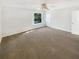 Neutral bedroom with carpet, a window, and a ceiling fan at 3230 Buck Hill Pl, Orlando, FL 32817