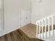 Bright foyer featuring a staircase, neutral tile, and a coat closet at 3230 Buck Hill Pl, Orlando, FL 32817