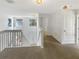 Hallway area with carpet and view of stairs and unique windows at 3230 Buck Hill Pl, Orlando, FL 32817