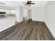 Open concept living space that features new floors, white walls, and lots of natural light at 3230 Buck Hill Pl, Orlando, FL 32817