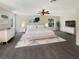 Spacious bedroom featuring a large bed, ample natural light, and stylish decor at 3230 Buck Hill Pl, Orlando, FL 32817