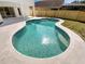 Clear, refreshing pool features a sun-drenched patio and a newly constructed wooden fence at 3230 Buck Hill Pl, Orlando, FL 32817