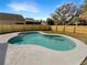 Sparkling swimming pool features a concrete deck, new wooden fence, and beautiful landscaping at 3230 Buck Hill Pl, Orlando, FL 32817