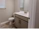 Half bathroom with vanity and neutral tones at 367 Sofia Ln, Lake Alfred, FL 33850