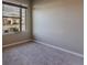 Bright bedroom featuring a window with neighborhood views and neutral carpeting at 367 Sofia Ln, Lake Alfred, FL 33850