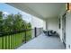 Relaxing balcony area overlooking lush landscaping and seating at 4000 Breakview Dr # C207, Orlando, FL 32819