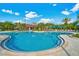 Community pool with cabana, lounge chairs and umbrellas, offering a relaxing and inviting outdoor experience at 4000 Breakview Dr # C207, Orlando, FL 32819