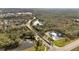 Aerial view of landscaped community entrance with lush greenery, ponds, and winding roads at 4019 Alcott Cir, Orlando, FL 32828