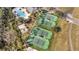 Aerial view of community tennis and volleyball courts, pool, and clubhouse at 4019 Alcott Cir, Orlando, FL 32828