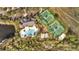 Aerial view of the community pool, playground, tennis courts, sand volleyball and clubhouse at 4019 Alcott Cir, Orlando, FL 32828