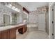 Bathroom with double vanity, granite countertops, soaking tub and separate shower at 4019 Alcott Cir, Orlando, FL 32828