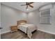 Bedroom with a ceiling fan, hardwood floors and natural light at 4019 Alcott Cir, Orlando, FL 32828