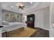 Bedroom features tray ceiling, dark hardwood floors, and a cozy window seat at 4019 Alcott Cir, Orlando, FL 32828