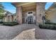 Inviting clubhouse entrance with brick facade, well-maintained landscaping, and clear signage at 4019 Alcott Cir, Orlando, FL 32828