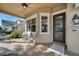 Cozy front porch with comfortable seating, ceiling fan, and a welcoming entrance at 4019 Alcott Cir, Orlando, FL 32828