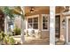 Inviting front porch featuring a ceiling fan, outdoor seating and natural light at 4019 Alcott Cir, Orlando, FL 32828