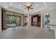 Bright living room with tile flooring, sliding glass doors, and a built-in entertainment center at 4019 Alcott Cir, Orlando, FL 32828