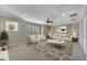 Inviting living room featuring neutral walls, ceiling fan, and bright window for ample sunlight at 4019 Alcott Cir, Orlando, FL 32828