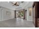 Open living space features tile floors, a tray ceiling with fan, and access to the patio through sliding glass doors at 4019 Alcott Cir, Orlando, FL 32828