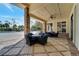 Covered patio area with brick columns, ceiling fan, and ample seating at 4019 Alcott Cir, Orlando, FL 32828