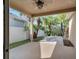 Covered patio leads to tropical backyard with privacy fence at 4019 Alcott Cir, Orlando, FL 32828