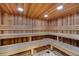 Community sauna featuring wood paneling, benches, and recessed lighting providing a soothing retreat at 4019 Alcott Cir, Orlando, FL 32828