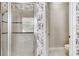 Shower boasts tile surround with glass door and built-in shelving at 4019 Alcott Cir, Orlando, FL 32828