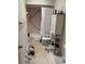 Bathroom with toilet, shower and white storage cabinet at 4864 Old Oak Tree Ct, Orlando, FL 32808