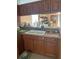 Kitchen featuring dark wood cabinets and light-colored countertops at 4864 Old Oak Tree Ct, Orlando, FL 32808