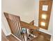 View of the wooden staircase and an overhead view of the comfortable living room at 5293 Willow Ct # 522, Orlando, FL 32811