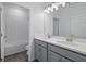 Well-lit bathroom features a double sink vanity and a shower/tub combo with tile surround at 5960 Vision Rd, St Cloud, FL 34771