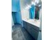 Bathroom featuring a double sink vanity with modern fixtures and a shower at 5960 Vision Rd, St Cloud, FL 34771