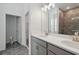 Ensuite bathroom featuring a double sink vanity and glass walk-in shower at 5960 Vision Rd, St Cloud, FL 34771