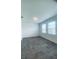 Bright bedroom with tile floors, two windows offering ample natural light and backyard views at 5960 Vision Rd, St Cloud, FL 34771