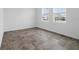 Bright, airy bedroom features a spacious open floor plan with tile flooring and natural light at 5960 Vision Rd, St Cloud, FL 34771