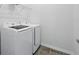 The laundry room features a modern washer and dryer setup with ample space at 5960 Vision Rd, St Cloud, FL 34771