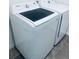 Modern laundry room featuring a front load washing machine and matching dryer with tiled flooring at 5960 Vision Rd, St Cloud, FL 34771