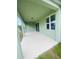 A covered outdoor patio offers an inviting space for relaxation and enjoyment of the backyard at 5960 Vision Rd, St Cloud, FL 34771