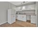 Functional kitchenette with white cabinets, countertop, microwave, and a compact refrigerator at 610 Nadina Pl, Celebration, FL 34747