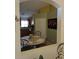 View from a dining area into a kitchen space with wood cabinets and tile countertops at 680 Caribou Ct, Apopka, FL 32703