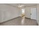 Bedroom with tile floors, ceiling fan, and view of adjacent bathroom area at 700 Roby Ct, Dundee, FL 33838