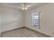 Bedroom featuring tile floors, a ceiling fan, and a window providing natural light and a view at 700 Roby Ct, Dundee, FL 33838