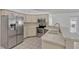 Kitchen with stainless steel appliances and white tile countertops at 700 Roby Ct, Dundee, FL 33838