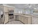 Kitchen with stainless steel appliances and white tile countertops at 700 Roby Ct, Dundee, FL 33838