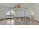 Spacious living room featuring tile flooring and decorative leaded glass front door and sidelights at 700 Roby Ct, Dundee, FL 33838